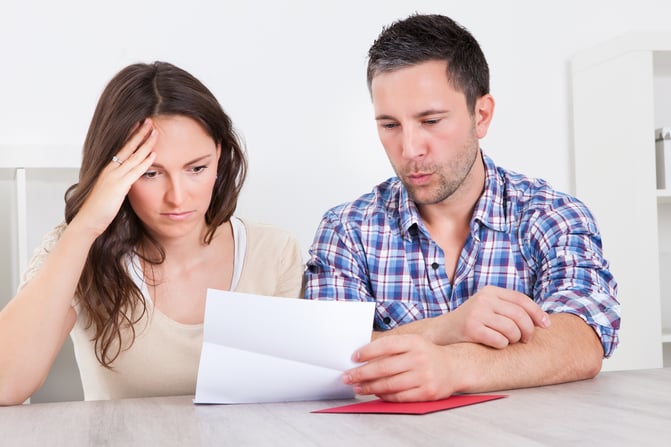 Couple looking at their utility bill